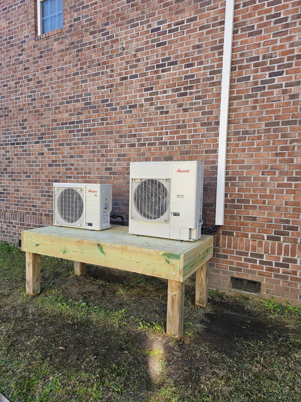 Mini-split condensers mounted on an elevated wooden stand at a coastal South Carolina home